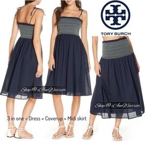 Navy blue dress - Smocked bodice with light blue, green, and orange stitching.